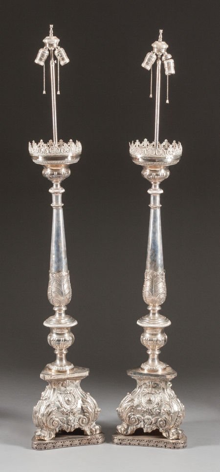 A PAIR OF ITALIAN BAROQUE-STYLE SILVERED METAL P: A PAIR OF ITALIAN BAROQUE-STYLE SILVERED METAL PRICKETS MOUNTED AS LAMPS20th century59
