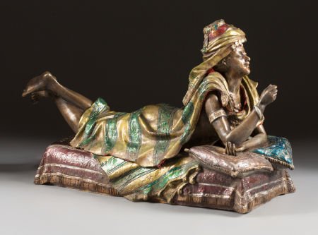 A FOUR-PART POLYCHROMED BRONZE METAMORPHIC FIGUR: A FOUR-PART POLYCHROMED BRONZE METAMORPHIC FIGURE OF AN EROTIC EUROPEAN WOMAN IN MIDDLE EASTERN COSTUM