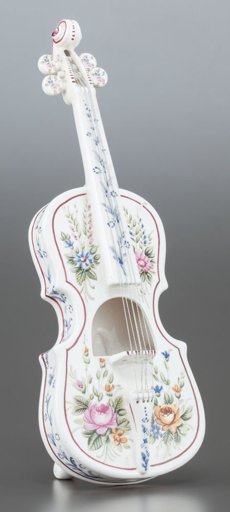 A CONTINENTAL PAINTED PORCELAIN VIOLIN 20th cent: A CONTINENTAL PAINTED PORCELAIN VIOLIN 20th century Marks: 6928 P 15 inche