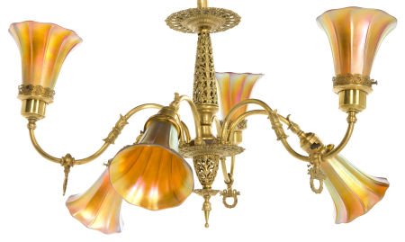 AN AMERICAN BRASS SIX-LIGHT CHANDELIER WITH IRID: AN AMERICAN BRASS SIX-LIGHT CHANDELIER WITH IRIDESCENT GLASS SHADES Glass attributed