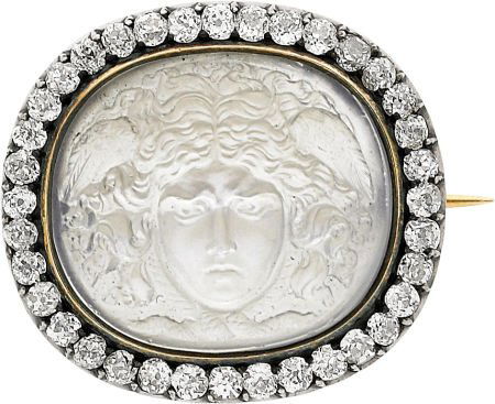 Victorian Moonstone, Diamond, Silver-Topped Gold: Victorian Moonstone, Diamond, Silver-Topped Gold Brooch The brooch features a carved moons
