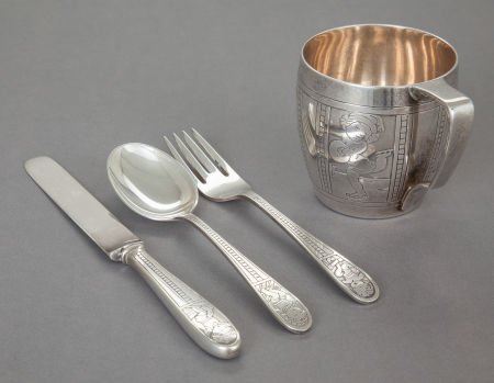 A FOUR PIECE TIFFANY & CO. SILVER CHILD'S FLATWA: A FOUR PIECE TIFFANY & CO. SILVER CHILD'S FLATWARE SET AND CUP Tiffany & Co., New York, New