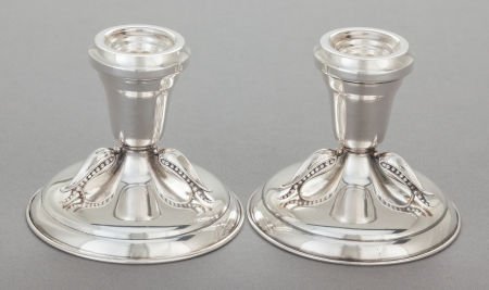 A PAIR OF CARL PETERSEN CANADIAN SILVER CANDLEST: A PAIR OF CARL PETERSEN CANADIAN SILVER CANDLESTICKSCarl Poul Petersen, Montreal, Canada,