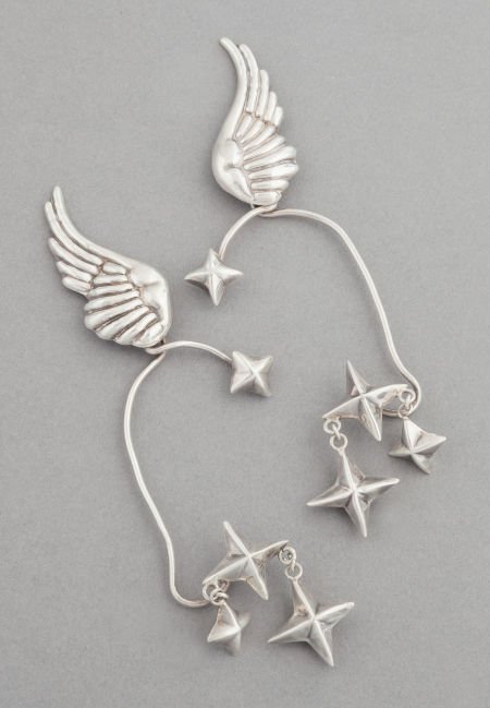 A PAIR OF HUBERT HARMON MEXICAN SILVER EAR CUFFS: A PAIR OF HUBERT HARMON MEXICAN SILVER EAR CUFFS Hubert Harmon, Taxco, Mexico, circa