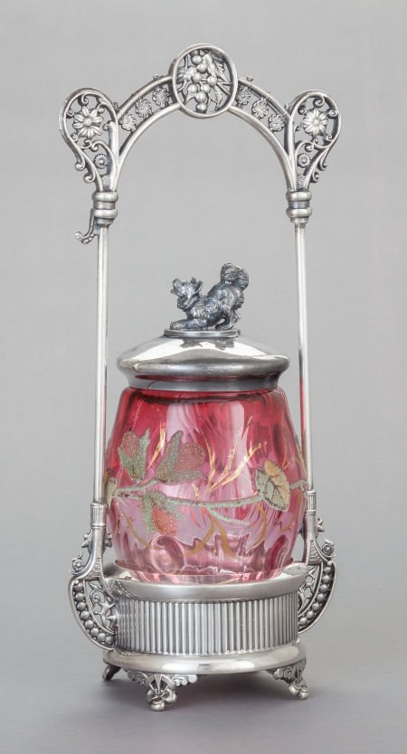 AN E.G. WEBSTER & SON SILVER-PLATED PICKLE STAND: AN E.G. WEBSTER & SON SILVER-PLATED PICKLE STAND WITH ENAMELED CRANBERRY GLASS JAR E.G. Web