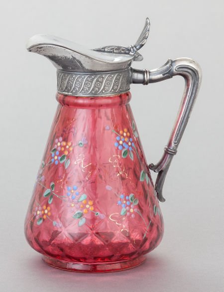 A JAMES W. TUFTS SILVER-PLATED AND ENAMELED CRAN: A JAMES W. TUFTS SILVER-PLATED AND ENAMELED CRANBERRY GLASS PITCHERJames W. Tufts, Boston,