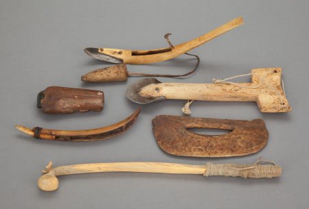 SIX ESKIMO CARVED BONE AND IVORY TOOLS c. 1900: SIX ESKIMO CARVED BONE AND IVORY TOOLS c. 1900 including a whalebone ulu; a bone and ivo