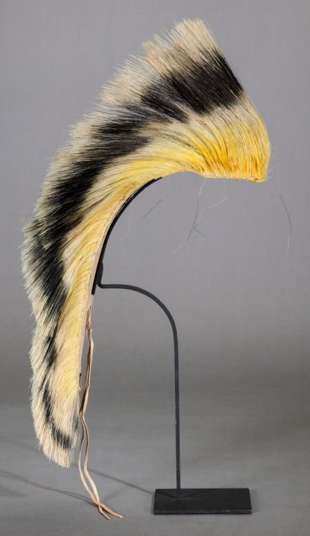 A SOUTHERN PLAINS HAIR ROACH c. 1900: A SOUTHERN PLAINS HAIR ROACHc. 1900 composed of yellow-dyed deer hair, enclosing a pane