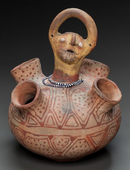 A MOHAVE POLYCHROME EFFIGY VESSEL c. 1900: A MOHAVE POLYCHROME EFFIGY VESSELc. 1900with four spouts centering a female figure and