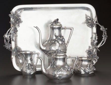 A FOUR PIECE GERMAN SILVER AND SILVER GILT TEA S: A FOUR PIECE GERMAN SILVER AND SILVER GILT TEA SERVICE AND TRAY, circa 1920 Marks: (cr