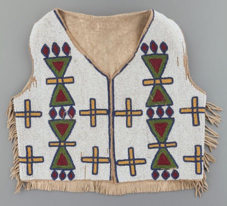 A BLACKFOOT BEADED HIDE VEST c. 1900: A BLACKFOOT BEADED HIDE VEST c. 1900 hide, opaque and translucent glass beads, cotton cl