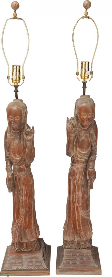 A PAIR OF CHINESE CARVED WOOD GUANYIN FIGURAL LA: A PAIR OF CHINESE CARVED WOOD GUANYIN FIGURAL LAMPS, 41-1/2 inches high (105.4 cm)FROM