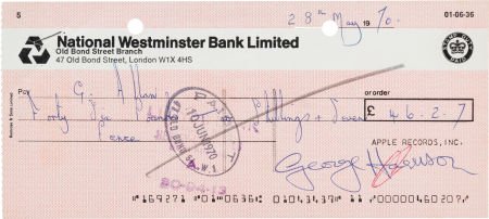 The Beatles: George Harrison Signed Check.: The Beatles: George Harrison Signed Check. 8" x 3.5". Drawn on the National Westminster B