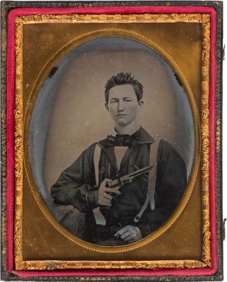 Quarter Plate Ambrotype of Armed Soldier. Hand-t: Quarter Plate Ambrotype of Armed Soldier. Hand-tinted portrait of seated soldier holding