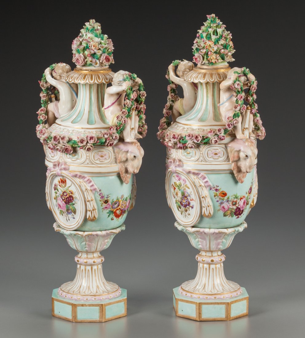 A Pair of Continental Porcelain Urns with Putti (1 of 3)