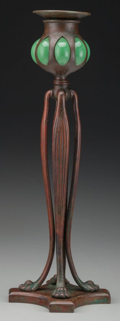 A Tiffany Studios Bronze and Green Favrile Glass: A Tiffany Studios Bronze and Green Favrile Glass Candlestick, Corona, New York, circa 190