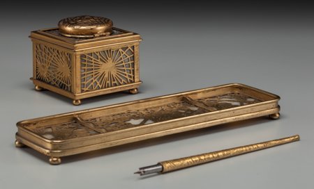 A Three-Piece Tiffany Studios Gilt Bronze and Fa: A Three-Piece Tiffany Studios Gilt Bronze and Favrile Glass Desk Set, Corona, New York, e