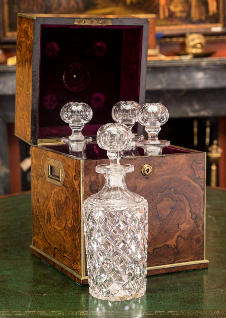 An English Burled Mahogany and Cut-Glass Tantalus, mid-: An English Burled Mahogany and Cut-Glass Tantalus, mid-19th century Marks: HOWELL, JAMES & CO, REGENT STREET LONDON 12 h x 9-3/8 w x 9-1/2 d inches (30.5 x 23.8 x 24.1 cm) The tantalus with exterior c
