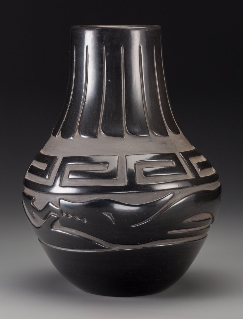 A Santa Clara Carved Blackware Jar Elizabeth Naranjo c.: A Santa Clara Carved Blackware Jar Elizabeth Naranjo c. 1990 clay, paint, signed on the base, Elizabeth Naranjo, Santa Clara Pueblo Provenance: Property from the Collection of Dr. Gerald and Mr