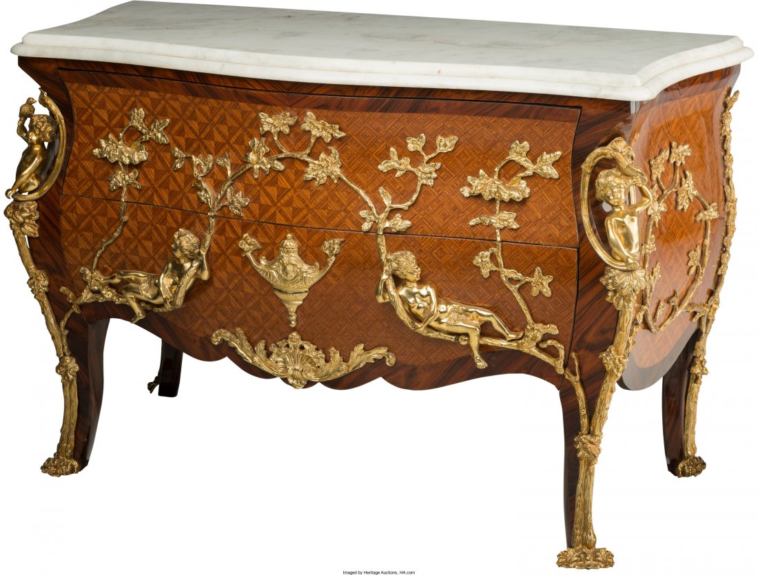 A Louis XVI-Style Parquetry and Gilt Bronze-Moun: A Louis XVI-Style Parquetry and Gilt Bronze-Mounted Commode, 20th century 37 h x 55-1/2 w x 26 d in