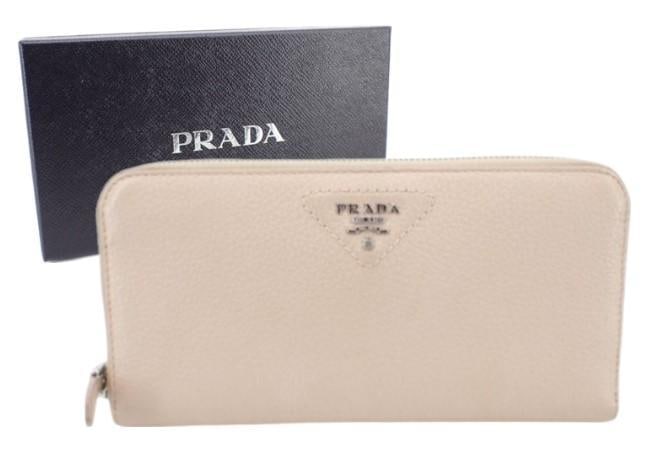 Prada Mauve Long Zipper Wallet: Important information regarding luxury brand items: Please carefully review the photographs provided as these items are pre-owned and may exhibit varying degrees of wear. Due to the nature of these it