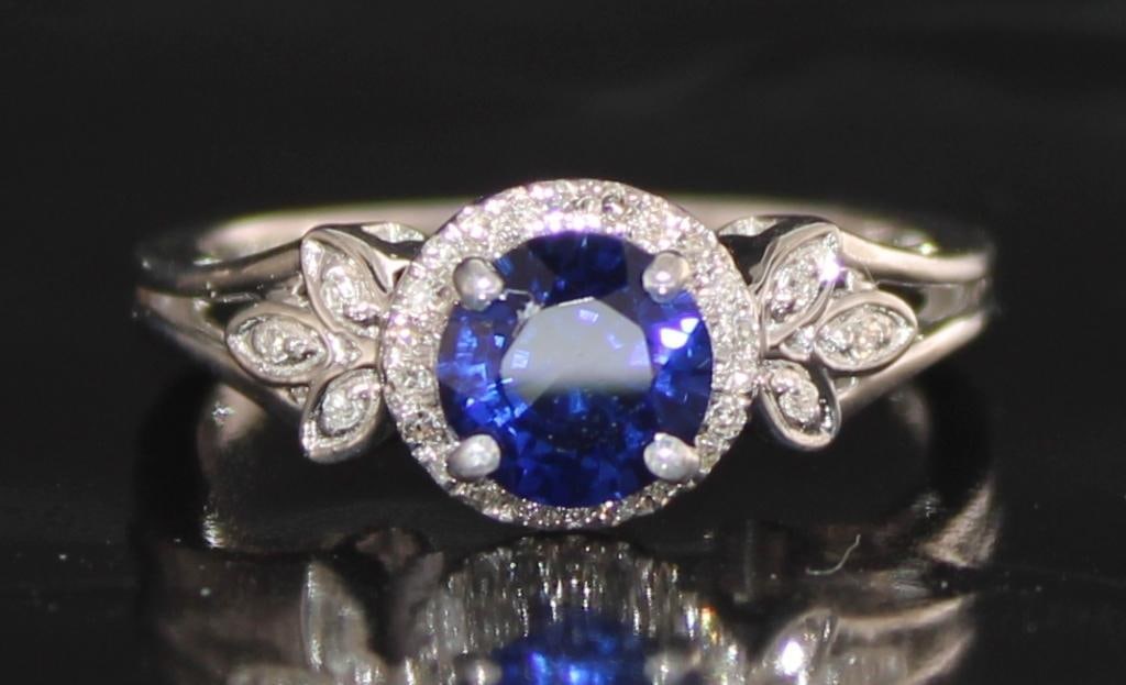 10k Gold 1.15 ct Sapphire & Diamond Ring: PGL Digital Appraisal Included. Retail Replacement Value $3,885 (1) Corundum Blue Sapphire Cut: RoundCarat Weight: 1.05 Measurements: 5.70x5.70 Treatment: Diffusion , Heat & Pressure 10kt Gold Nat