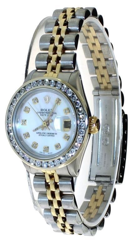 Rolex Oyster Perpetual Lady Datejust 26 w/Diamond: Authenticity Guaranteed. Genuine Pre-Owned Rolex. Watch is sold with a 30 day warranty from the date of purchase to be in working order.Model: 69173 Dial: Mother of pearl w/Diamond Case diameter: 26mm