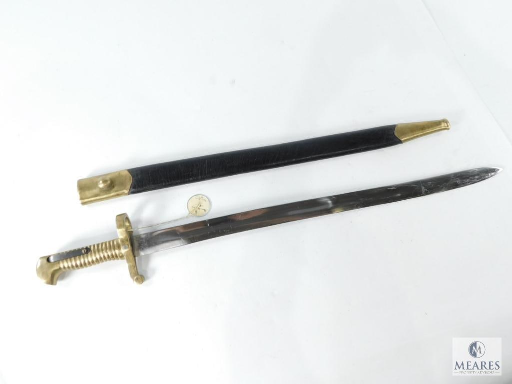 Replica 1863 Remington Rifle Musket Bayonet: It has a 20 1/4" blade with a solid brass handle. Comes with a scabbard and appears to be in very good condition.