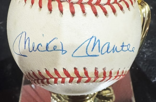 MICKEY MANTLE SIGNED AUTHENTICATED BASEBALL AND LIFE MAGAZINE: Mickey Mantle, known as "The Commerce Comet" or "The Mick," had one of the most storied careers in Major League Baseball history, playing his entire 18-year career with the New York Yankees (1951–19