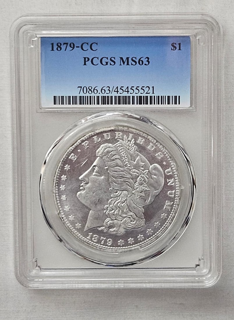 1879CC CARSON CITY SILVER DOLLAR, RARE DATE: Let me start by saying that as much as I want this coin to be genuine and worth $50,000, it is not. I have collected counterfeit coins for decades, a tradition passed down from my father when he got m