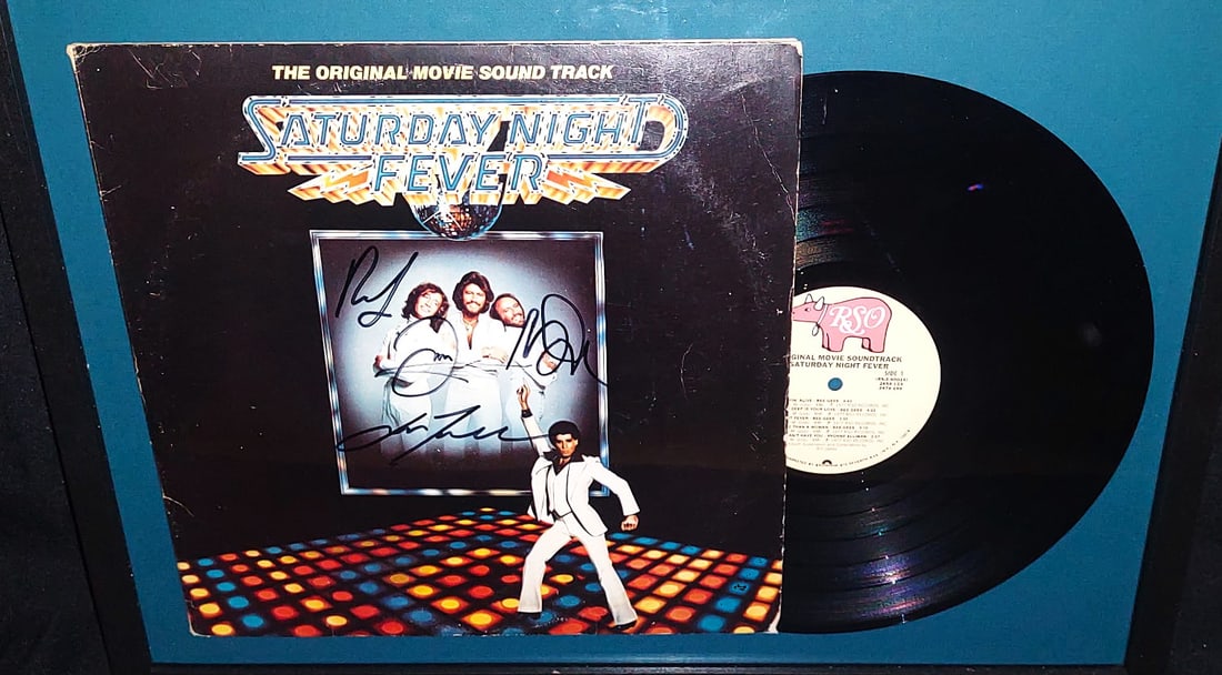 SATURDAY NIGHT FEVER SIGNED- BEE GEES TRAVOLTA: Saturday Night Fever Soundtrack (1977)The item is the original soundtrack for the 1977 film Saturday Night Fever, which remains one of the most culturally significant and best-selling albums in