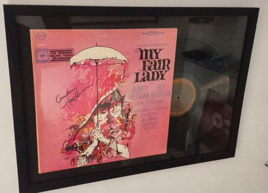 MY FAIR LADY SIGNED SOUNDTRACK ALBUM: My Fair Lady Soundtrack (1964)The item is the original motion picture soundtrack for the 1964 film adaptation of the Broadway musical, starring Audrey Hepburn and Rex Harrison. The Music: The score,