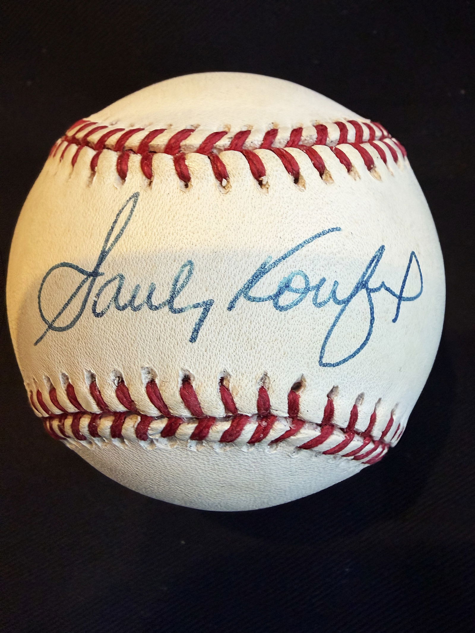 SANDY KOUFAX AUTHENTICATED SIGNED BASEBALL AND SPORTING NEWS BASEBALL REGISTER: BASEBALL HISTORY DISPLAYED WITH SANDY KOUFAX SIGNED BASEBALL AND ACCOMPANING SPORTING NEWS BASEBALL REGISTERSandy Koufax is widely considered one of the greatest and most dominant pitchers in