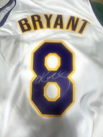 KOBE SIGNED AUTHENTICATED WHITE HOME JERSEY: Kobe Bryant was an American professional basketball player who spent his entire 20-year career with the Los Angeles Lakers.Career Highlights:5x NBA champion (2000, 2001, 2002, 2009, 2010)2x NBA
