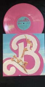 BARBIE SOUNDTRACK ALBUM, SIGNED AUTHENICATED: SIGNED BY "BARBIE" MARGOT ROBBIE Barbie is a 2023 fantasy comedy film directed by Greta Gerwig, who also co-wrote the screenplay with Noah Baumbach. The film is based on the popular fashion dolls by