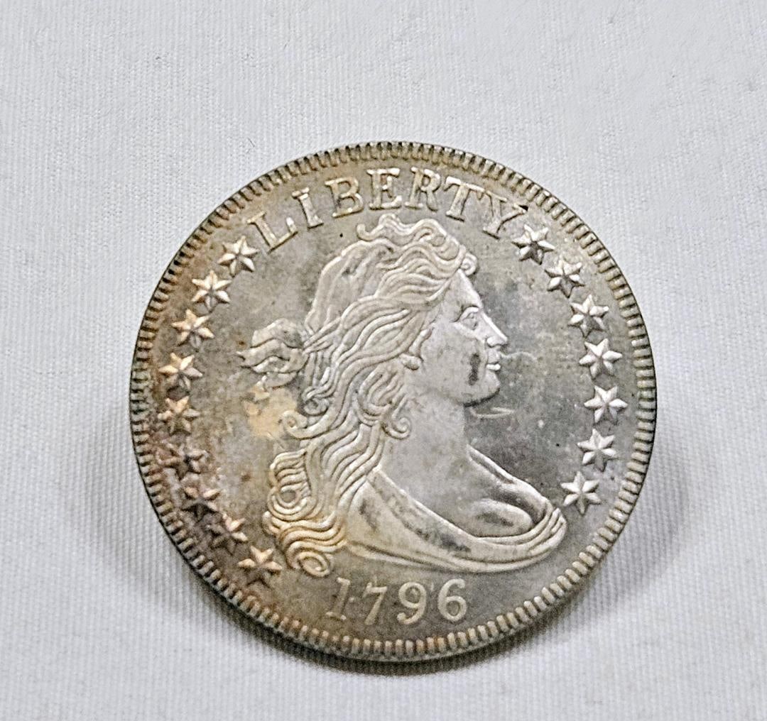 1796 DRAPED BUST HALF DOLLAR, GEM BU AND VERY RARE: This has to be told first. If this coin was genuine which it is not, the price would approach $1,000,000 or more. This is the rarest date half dollar in the entire history of United States coins. Sinc