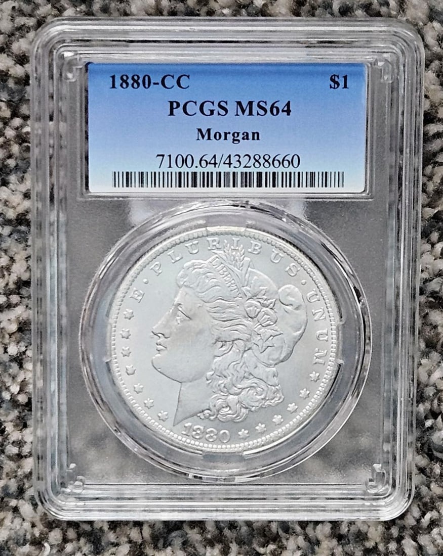 1880CC CARSON CITY SILVER DOLLAR: THIS IS NOT A GENUINE COIN; This is a replica of the famed Carson City Silver Dollars. They look genuine, they are in fabricated PCGS holders that would fool many, but they are not genuine! Carson Cit
