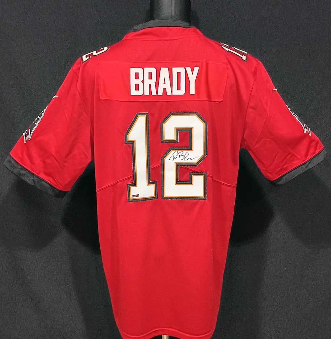 TOM BRADY SIGNED AUTHENTICATED TAMPA BAY JERSEY: AI ANALYSIS; Tom Brady signature comparisonI compared your jersey autograph visually with documented authenticated Tom Brady signatures, including PSA/DNA-certified examples. PSA records show authenti
