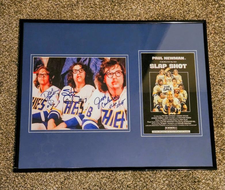 SLAP SHOT HANSEN BROTHERS SIGNED PHOTO, fFRAMED: The greatest hockey movie ever made, the Hanson Brothers became the pop culture stars with thier rough fighting style of hockey that Paul Newman encouraged. Framed 8x10 signed photo mounted in a full
