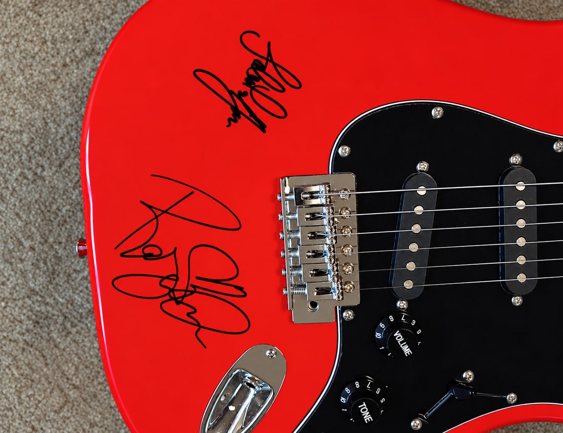 LED ZEPPELIN SIGNED GUITAR BY JIMMY PAGE, ROBERT PLANT, JOHN PAUL JONES: LED ZEPPELIN SIGNED GUITAR AI EVALUATION I reassessed the three signatures across your original photographs and compared the visible structures with authenticated/reference examples.My assessment