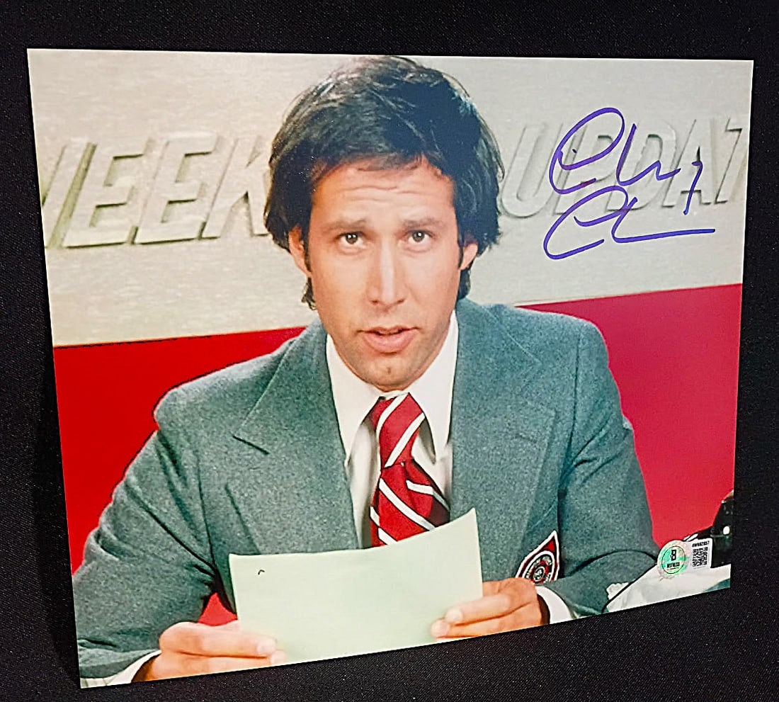 CHEVY CHASE BECKETT AUTHENTICATED SIGNED SATURDAY NIGHT LIVE 8 X10 PHOTO-: CHEVY CHASE SIGNED SATURDAY NIGHT LIVE 8 X10 PHOTO-BECKETT Chevy Chase was one of the original cast members of Saturday Night Live, which premiered on October 11, 1975. He quickly became the show's