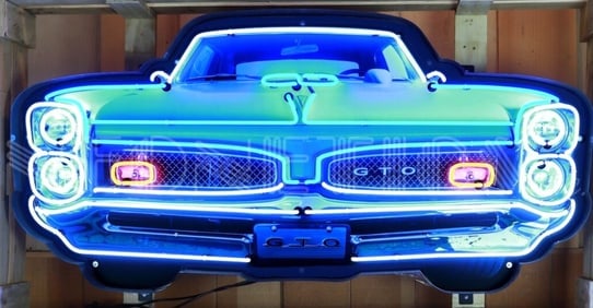 GTO GRILL NEON 60 x 29 x 6: 1967 Pontiac GTO. Subject: The sign is a detailed recreation of the distinctive front end of a 1967 GTO. The stacked headlights and the split, mesh grille are iconic design elements of this classic
