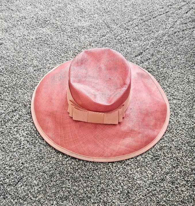 HILLARY CLINTON WORN DRESS HAT: HILLARY CLINTONS PINK WORN DRESS HAT WORN WHILE SHE SERVED THE COUNTRY AS FIRST LADY. Yes, you can say her style was polyester like, but at least she had a style. There are many photos of her wearing
