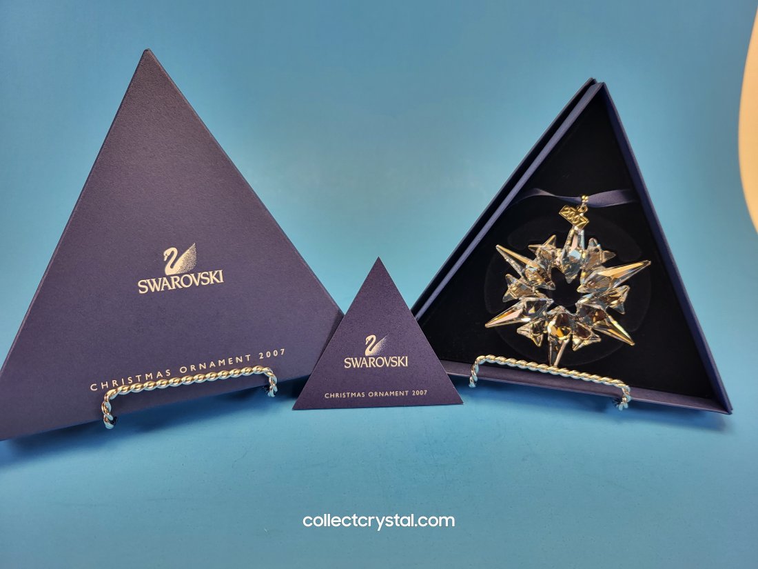 Swarovski 2007 Annual Star Snowflake Ornament: The ornament features a star shape made of clear crystal with 6 long points and the etched metal tag for the year it was produced and retired. So to find this piece in quality for the most decerning c