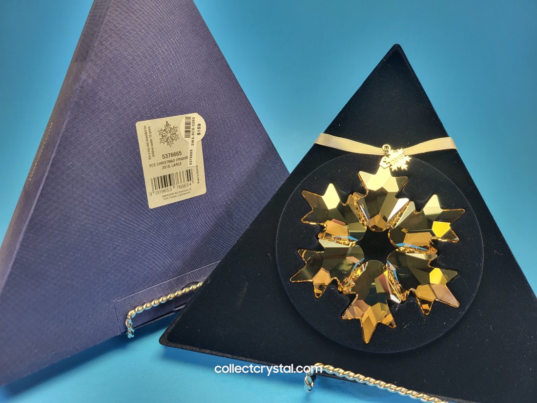 Swarovski 2018 Annual Star Snowflake Ornament: This snowflake designed with 156 beautifully crafted clear crystal facets and comes with a etched metal tag showing the year introduced and retired. This is the exact item you will receive as our visi