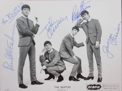 Beatles Signed NEMPOSE No 2 photo: This NEMS Enterprises promotional photo, titled "NEMPOSE No 1," features the legendary British rock band The Beatles during their early years of fame. The captivating black-and-white image showcases J