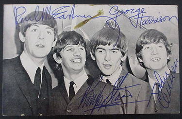 Beatles signed penny card signed by all four Beatles measuring 5 1/2 x 3 1/2