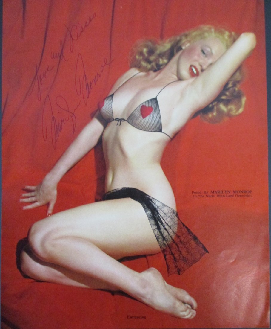 Marilyn Monroe golden dreams photo signed and inscribed love and kisses measuring 8 x 10: This 8 x 10 inch photo captures the timeless allure of Marilyn Monroe in her iconic "Golden Dreams" pose. The image showcases Monroe's radiant beauty and charisma, epitomizing her status as a Hollywoo