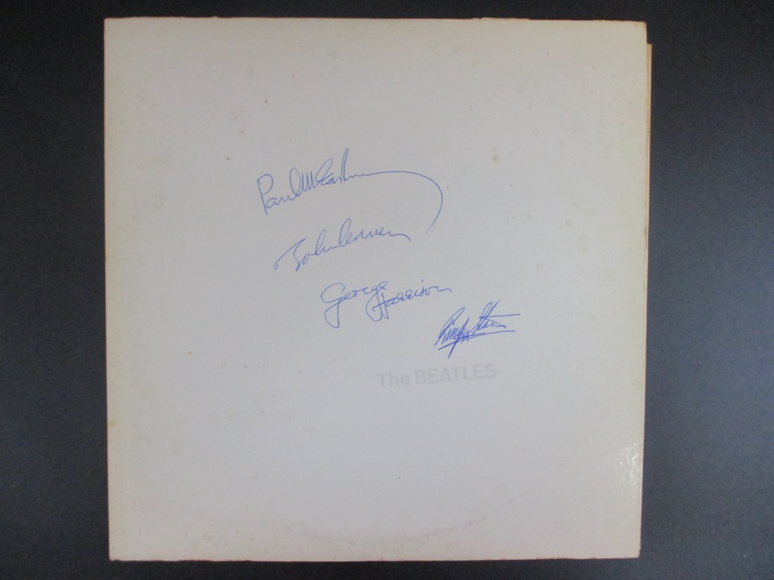 Beatles Signed Album Cover The Beatles White Album with Inserts and Photos: The "White Album," adorned with the iconic signatures of John, Paul, George, and Ringo, stands as a masterpiece of musical innovation and artistic expression. Enhanced by the inclusion of all inserts