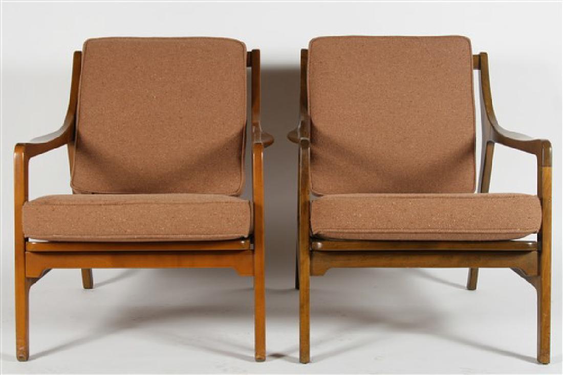 Pair of Scandia Mid-Century Modern Chairs: Pair of Mid-Century Modern Lounge Chairs. Manufactured by Scandia, Denmark. c. 1950's. Wood, metal, upholstery. Height: 28 1/4", Depth: 25 1/2", Width: 27 3/4" ea. One affixed with "Scandia - Designed